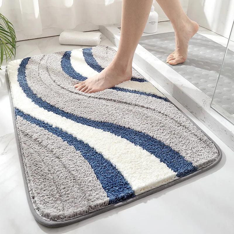 Soft organic weave bath rug in slate blue. Absorbent, non-slip microfiber floor mat for a cozy bathroom.
