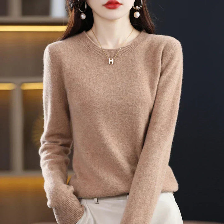 Women's long-sleeve crewneck pullover sweater. Soft, warm, and elegant for versatile casual outfits.