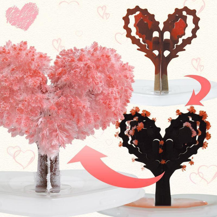 Hand holding a small, vibrant Magic Growing Crystal Tree, a charming novelty gift
