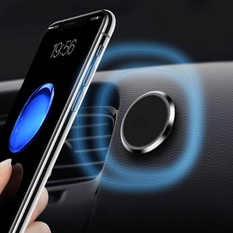 Magnetic car mount holding a smartphone on a dashboard for hands-free navigation. Universal car accessory.