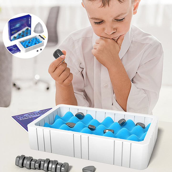 Child proudly holding a magnetic chess piece, indicating engagement with the educational toy.
