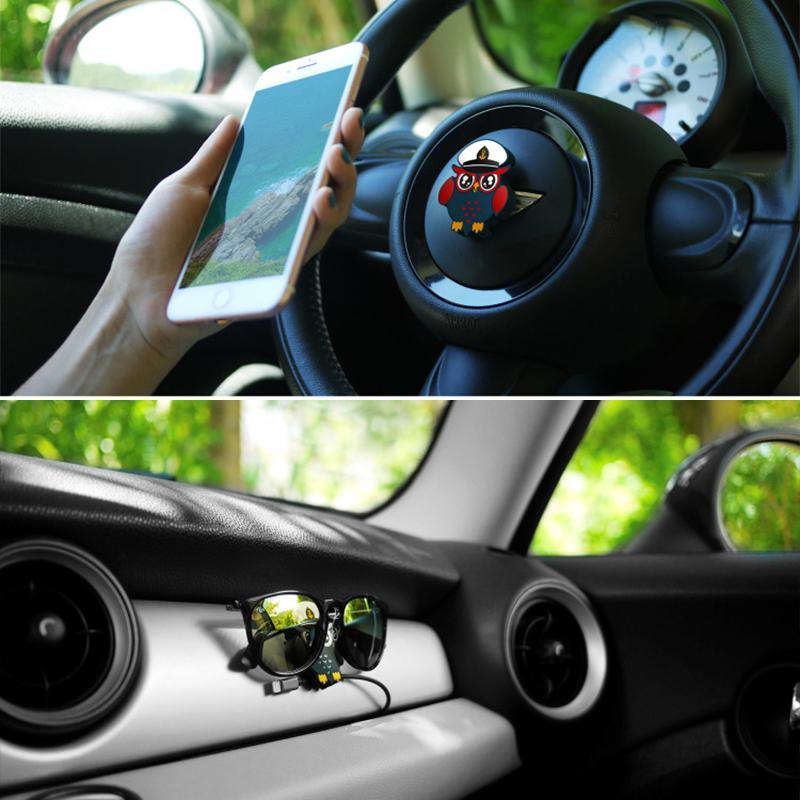 Compact magnetic phone holder in black, secures smartphone on desk or car, a versatile tech gadget.