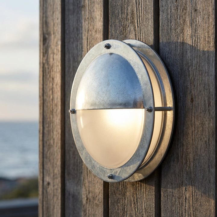Marinova round outdoor wall light in galvanized steel, perfect for weatherproof patio & porch exterior lighting.