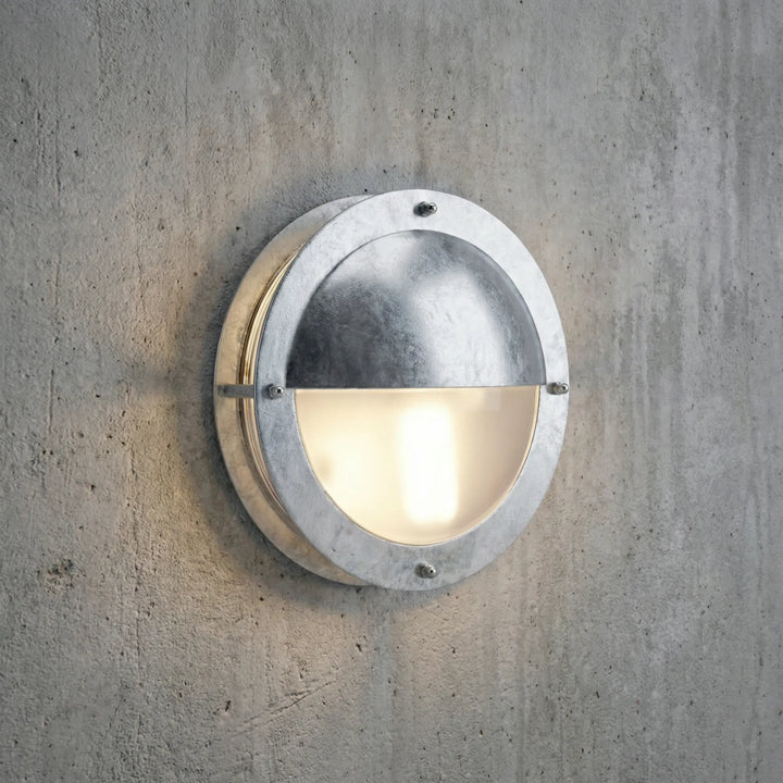 Stylish Marinova round dimmable LED outdoor wall light for modern home exterior, porch & entryway illumination.