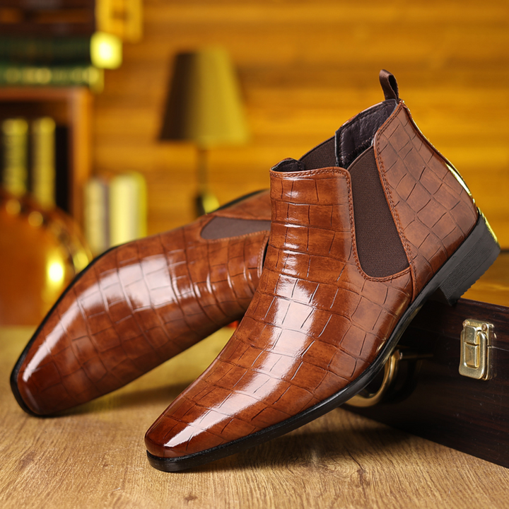 Men's black croc embossed Chelsea boots. Stylish, durable pull-on design for formal or casual wear.