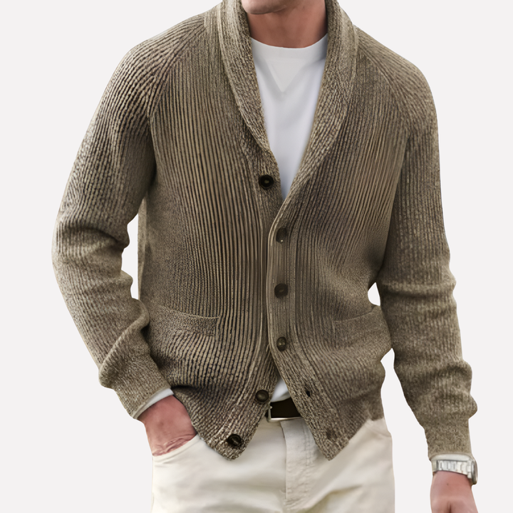 Classic men's shawl collar button-front cardigan, black knit, featuring distinctive patch pockets. Essential layering piece.