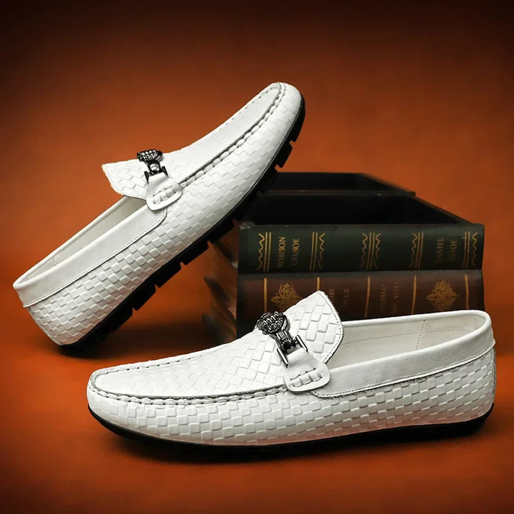 Men's white grip loafers from an overhead view, showing the sleek and simple slip-on design