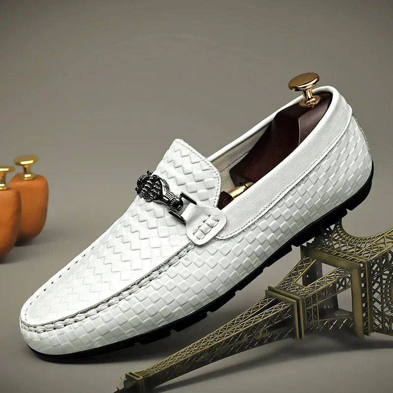 Pair of white men's leather grip loafers, stylish and comfortable slip-on casual shoes