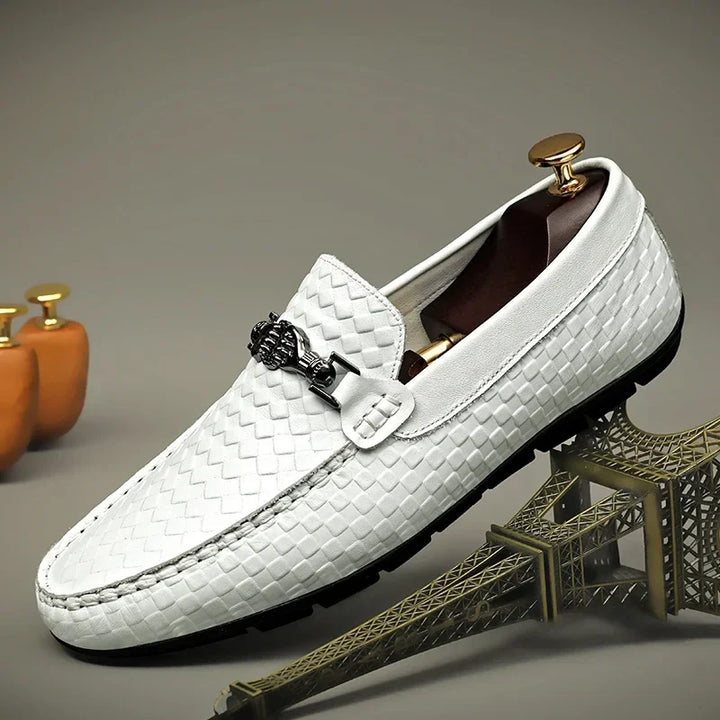 Pair of white men's leather grip loafers, stylish and comfortable slip-on casual shoes