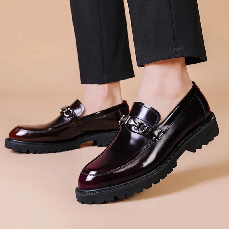 Side profile of men's formal slip-on loafers, designed for sophisticated business wear.
