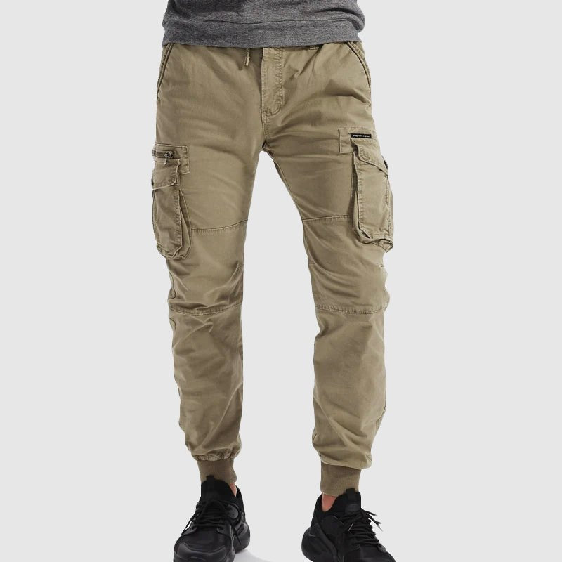 Comfortable men's olive green tactical cargo jogger pants, perfect for outdoor activities & casual fashion.