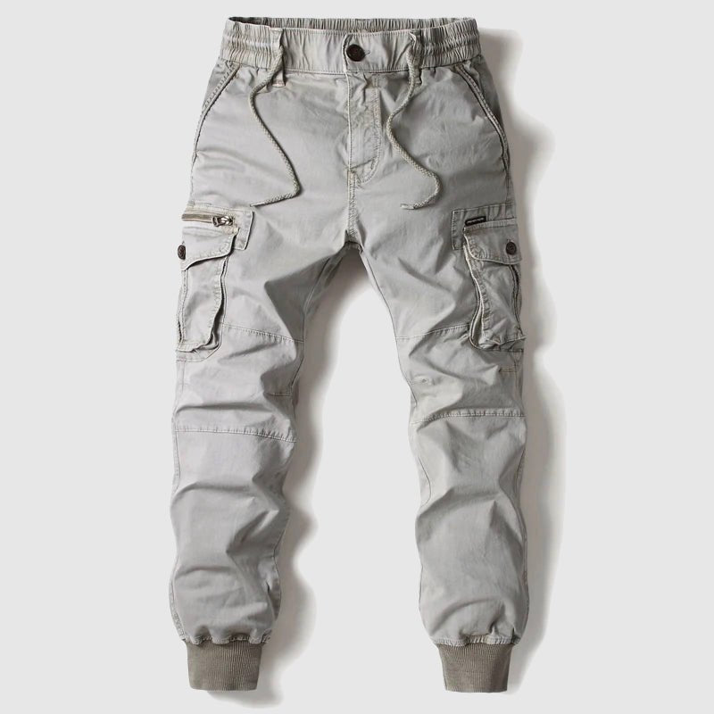 Stylish men's multi-pocket utility cargo joggers in a modern grey, great for streetwear & all-season wear.