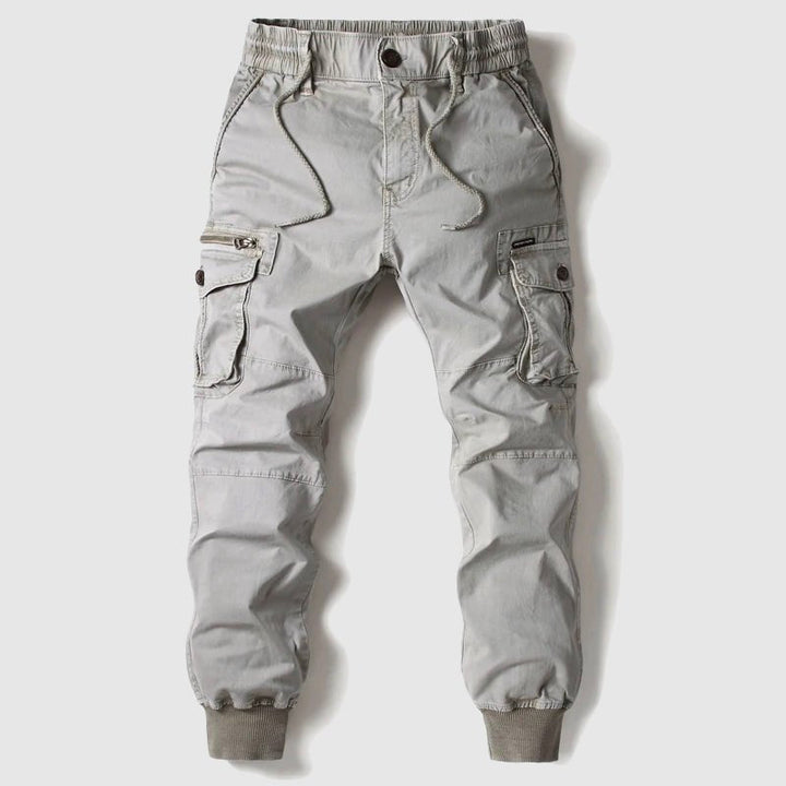 Stylish men's multi-pocket utility cargo joggers in a modern grey, great for streetwear & all-season wear.
