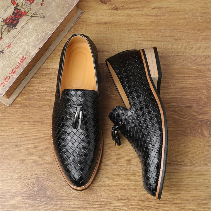 Detailed shot of the textured upper material of men's tassel loafers, fashion-forward design