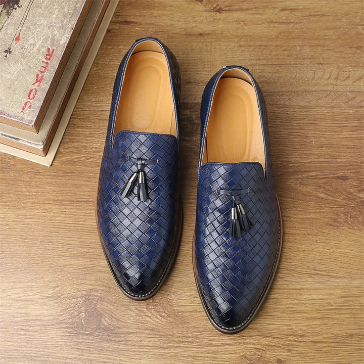Classic men's textured tassel loafers in a dark shade, suitable for various formal and casual events