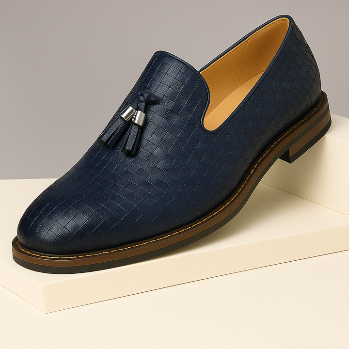 Pair of men's textured tassel loafers, showcasing detailed craftsmanship and elegant design