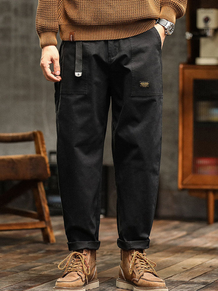 Army green men's casual utility pants, multi-pocket design and adjustable cuffs.
