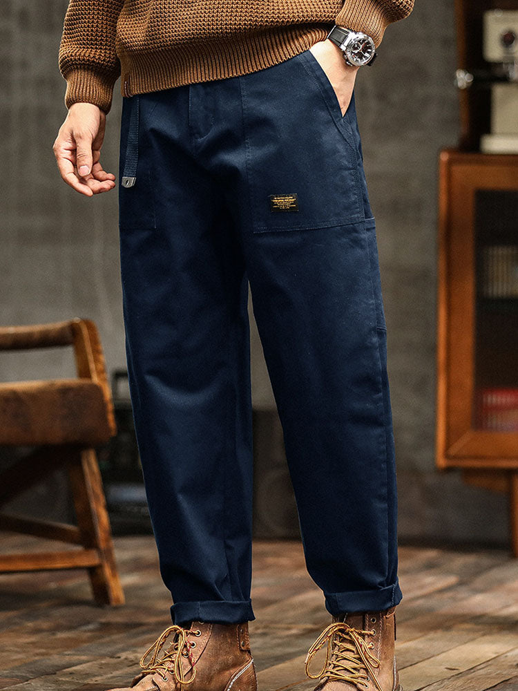 Relaxed fit khaki men's vintage utility pants, perfect for casual outings and outdoor fun.
