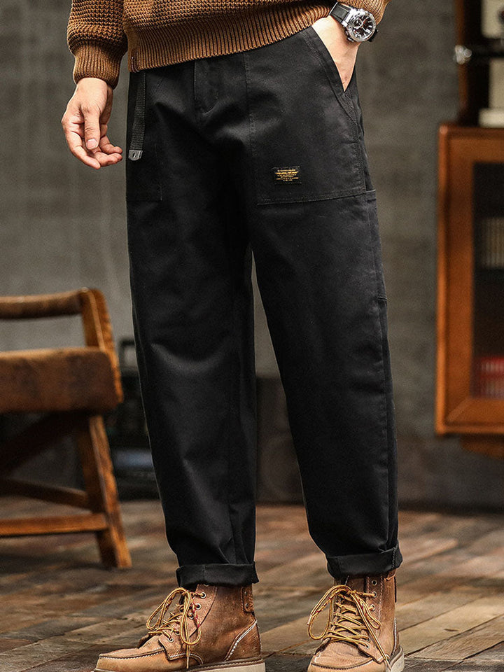 Army green men's vintage utility pants, workwear inspired, relaxed fit for casual wear.
