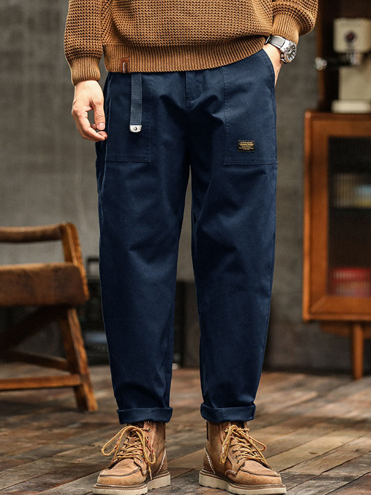 Navy blue men's utility pants with adjustable cuffs, vintage style for everyday comfort.