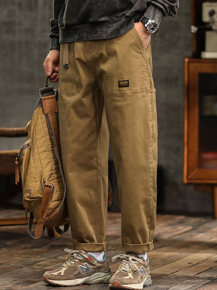 Khaki men's everyday utility pants, vintage style with practical multi-pocket design.