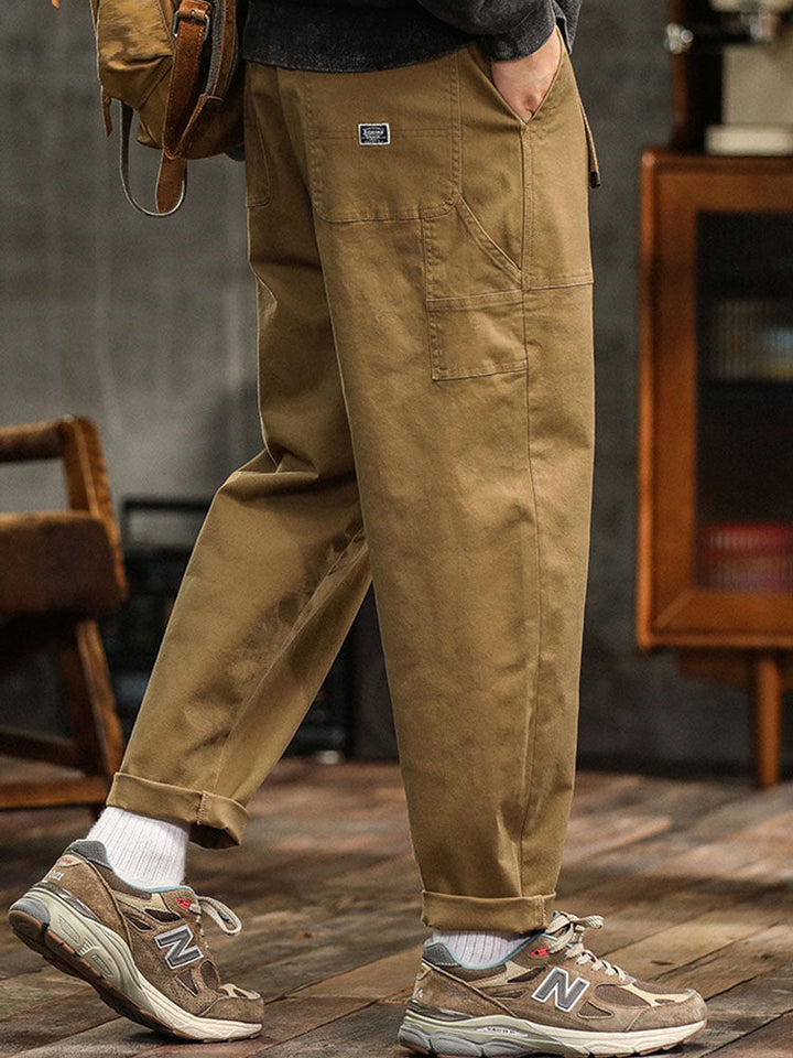 Black men's vintage utility pants, relaxed fit, ideal for casual and outdoor activities.