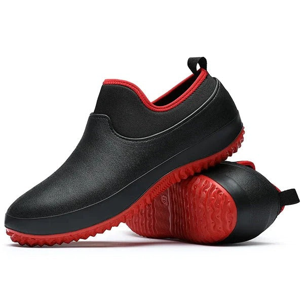 Men's black waterproof slip-on work shoes for all-day comfort. Non-slip safety footwear for industrial use.