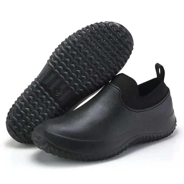 Red men's waterproof safety shoes. Slip-on design for all-day comfort & non-slip protection in industrial settings.