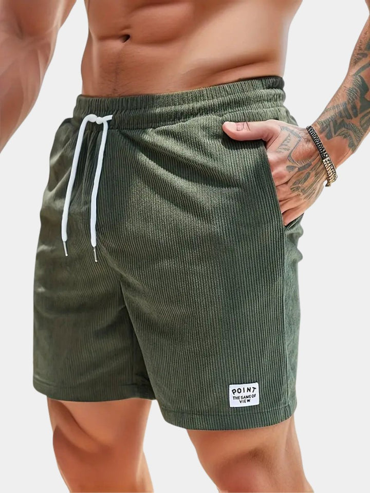 Men's blue quick-dry swim shorts for beach & pool, offering comfort & style.
