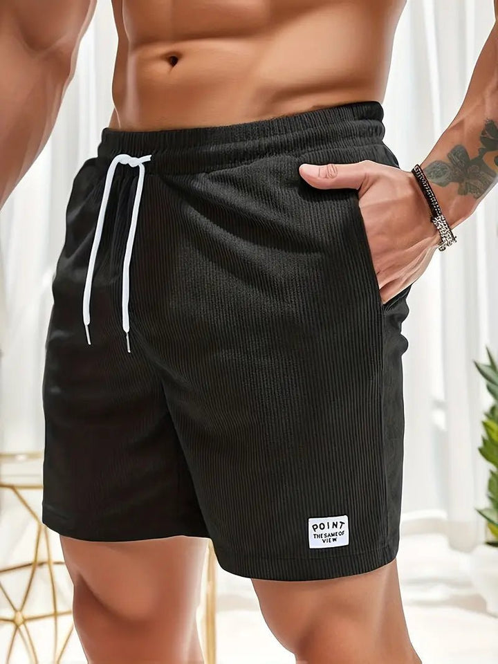 Printed men's quick-dry swim shorts, perfect for beach holidays & swimming.