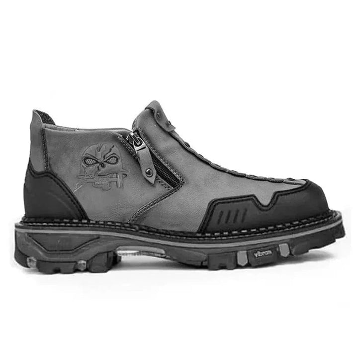 Men's bold black skull ankle boots with lace-up front and convenient side zipper for edgy, durable comfort.