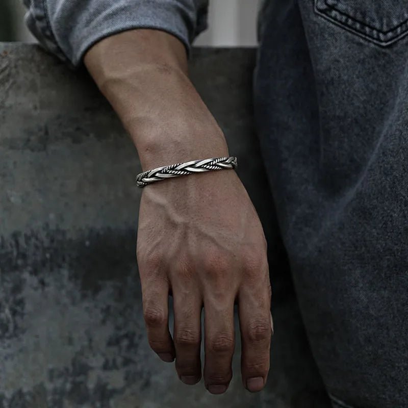 Oxidized sterling silver braided cuff bracelet for men. Sleek silver jewelry perfect for modern men's style.