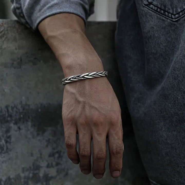 Oxidized sterling silver braided cuff bracelet for men. Sleek silver jewelry perfect for modern men's style.