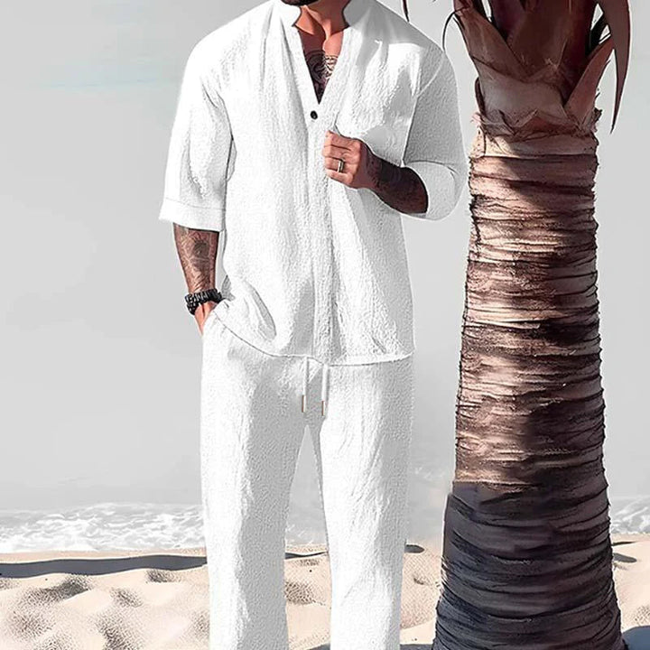 Relaxed fit men's two-piece cotton-linen lounge set with a button-down shirt & drawstring pants.