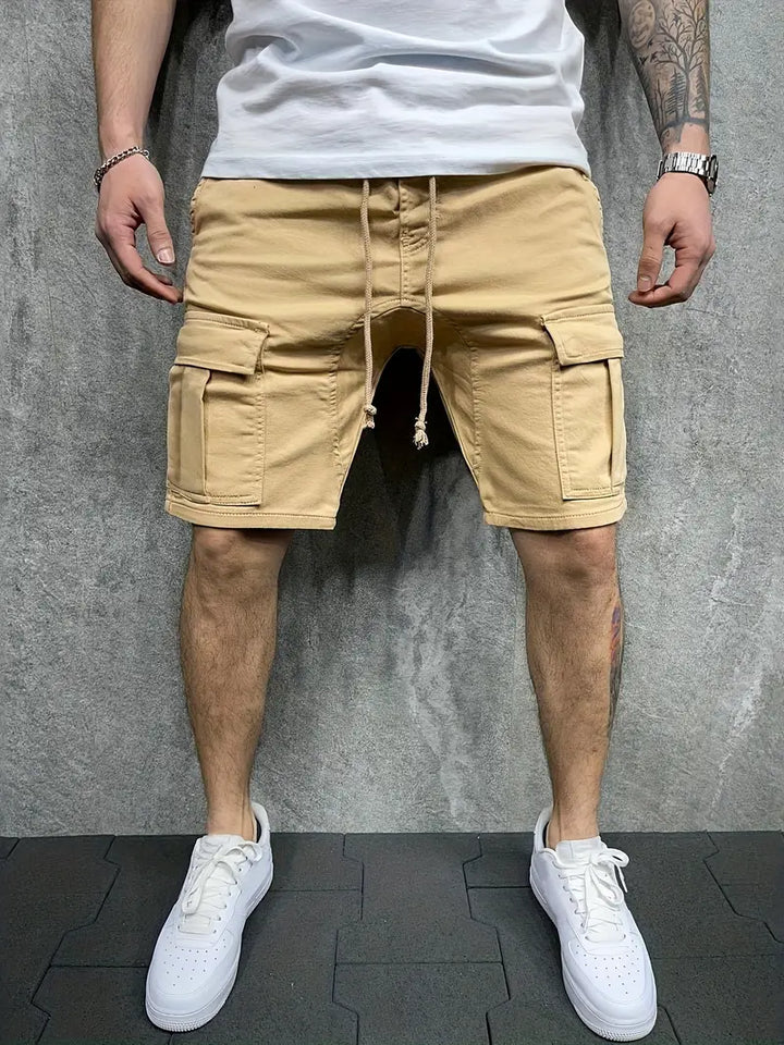 Relaxed fit men's cargo drawstring shorts, featuring multi-pockets and an elastic waist, perfect for comfortable utility wear.