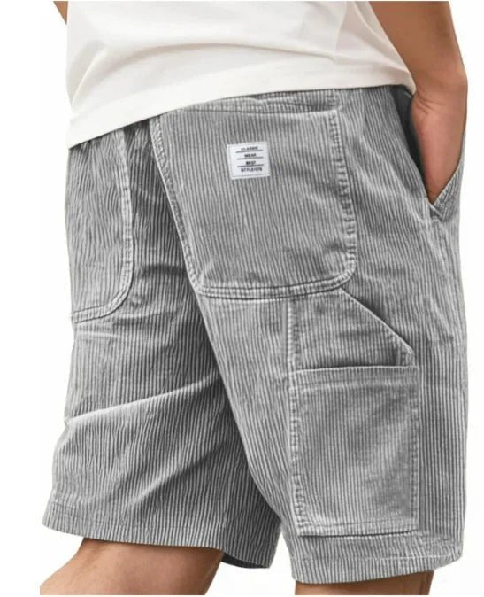 Men's casual cargo shorts, relaxed fit. Practical storage pockets combine utility with street style.