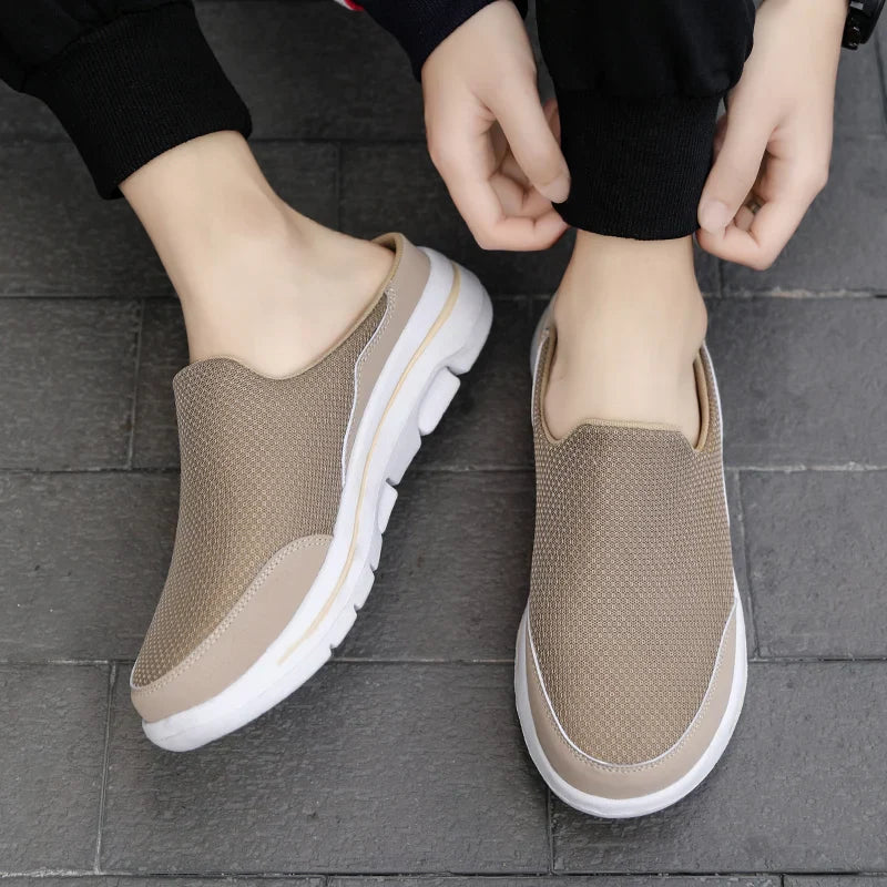 Comfortable men's closed-toe mule sandals with a slip-on design, perfect for casual summer style.
