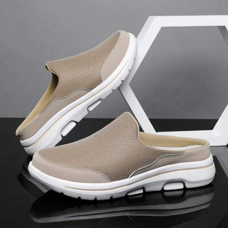 Versatile men's closed-toe slip-on mule sandals with a flat sole, perfect for comfortable casual everyday wear.