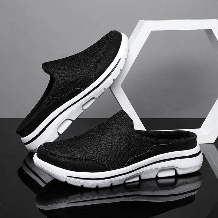 Stylish textured men's closed-toe mule sandals, a comfortable slip-on choice for casual summer outings.