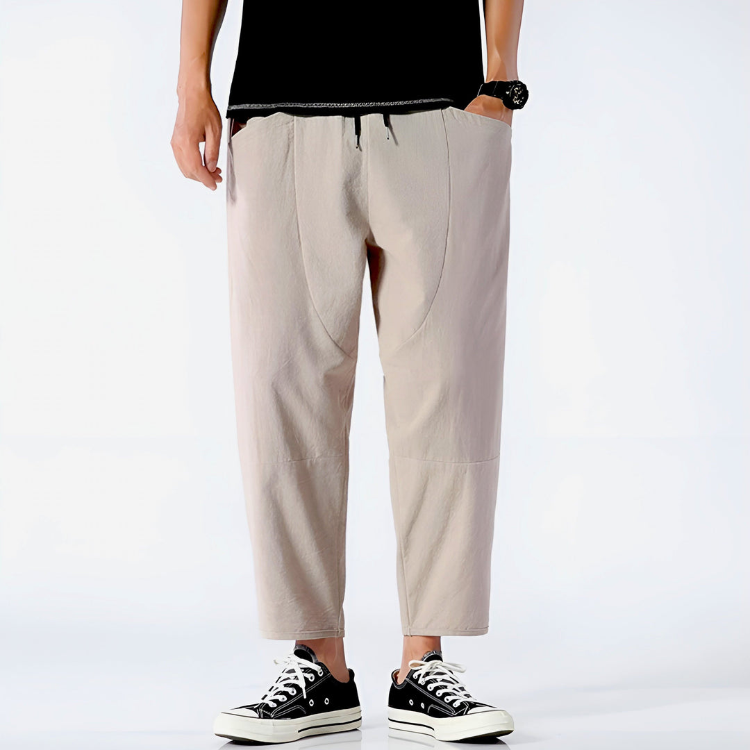 Modern men's cropped drawstring trousers, great for lounge or casual outdoor activities.