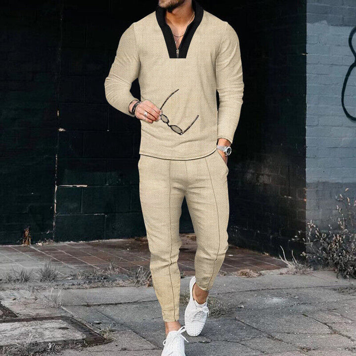 Men's casual khaki two-piece outfit featuring a zip-up top and comfortable trousers, ideal for modern leisurewear.