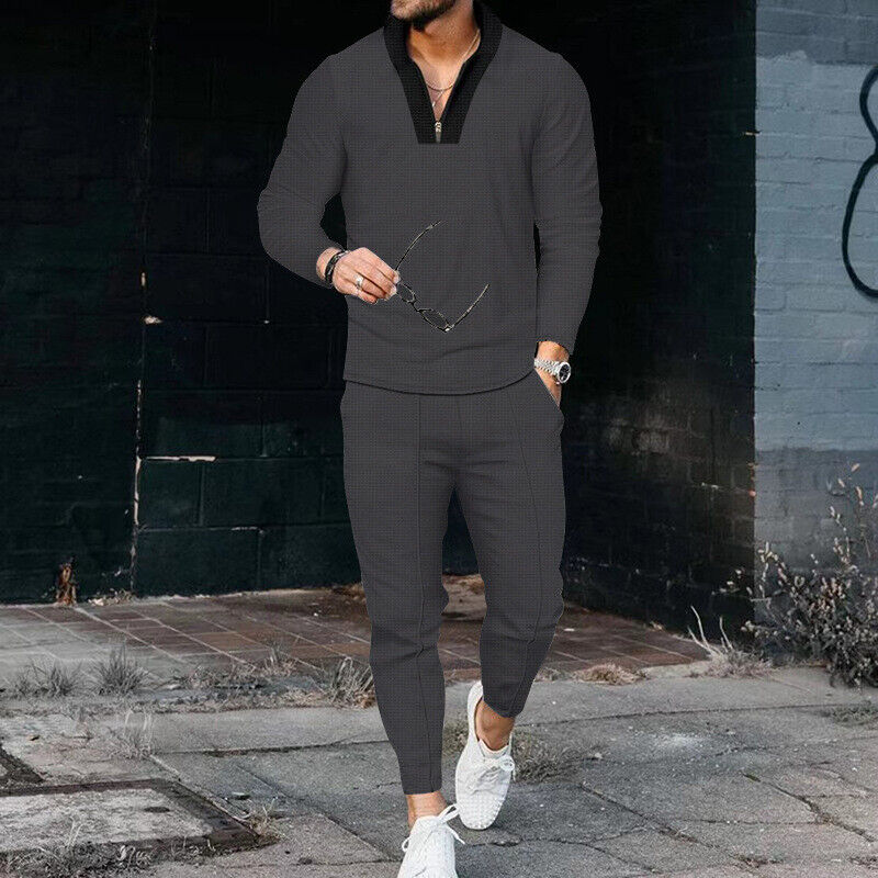 Men's casual two-piece outfit in black, showcasing a zip-up top and matching trousers designed for comfort and style.