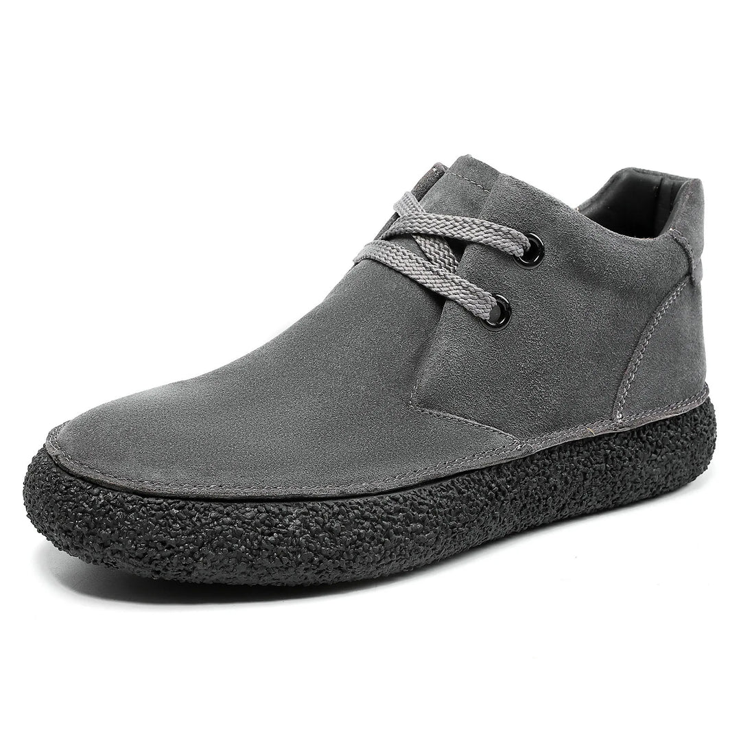 Front view of men's lace-up suede shoes, emphasizing the sleek design for various outfits