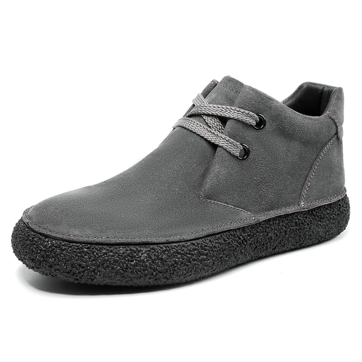 Front view of men's lace-up suede shoes, emphasizing the sleek design for various outfits