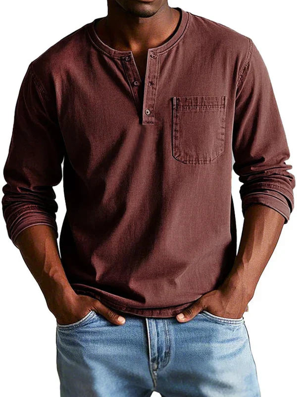 Texture detail of the soft fabric on a men's casual long sleeve henley shirt, comfortable apparel