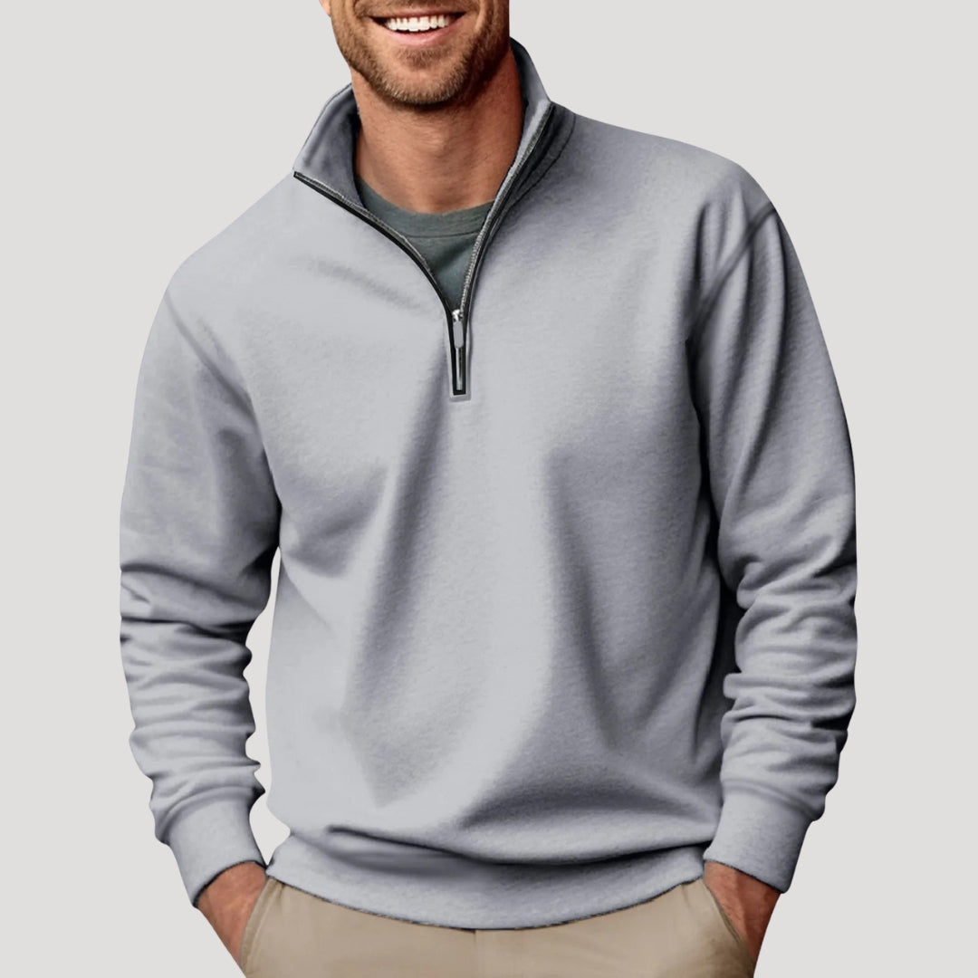 Man wearing a comfortable olive green quarter zip sweatshirt, suitable for men's casual fashion.