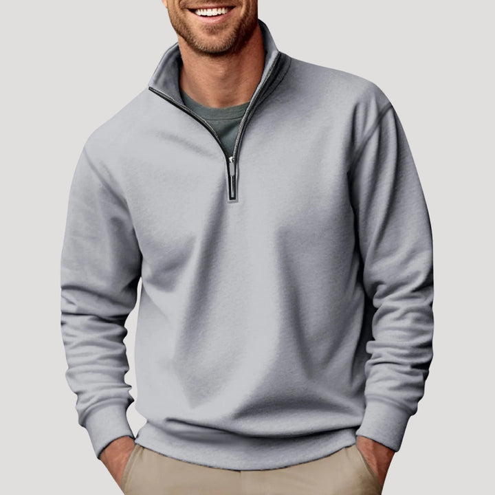 Man wearing a comfortable olive green quarter zip sweatshirt, suitable for men's casual fashion.