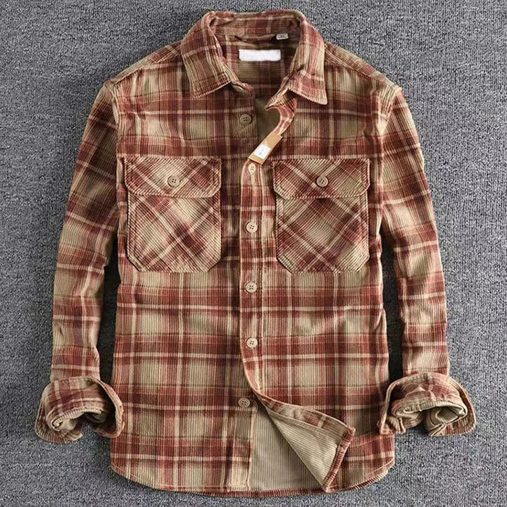 Close-up of a men's button-up flannel shirt, showcasing soft fabric and a timeless plaid design.