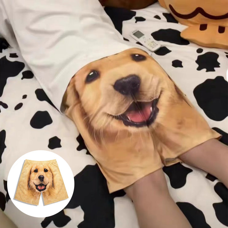 Close-up of men's beach shorts with detailed golden retriever print, perfect for summer activewear