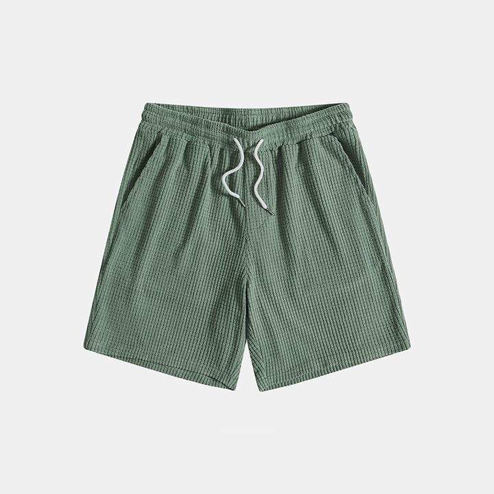 Men's short sleeve shirt and drawstring shorts two-piece set. Casual summer outfit for men's warm weather fashion.